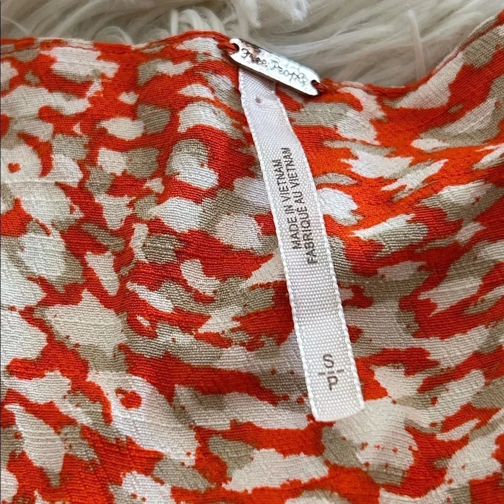 Free People French Quarter Wrap Mini Dress orange and white animal small